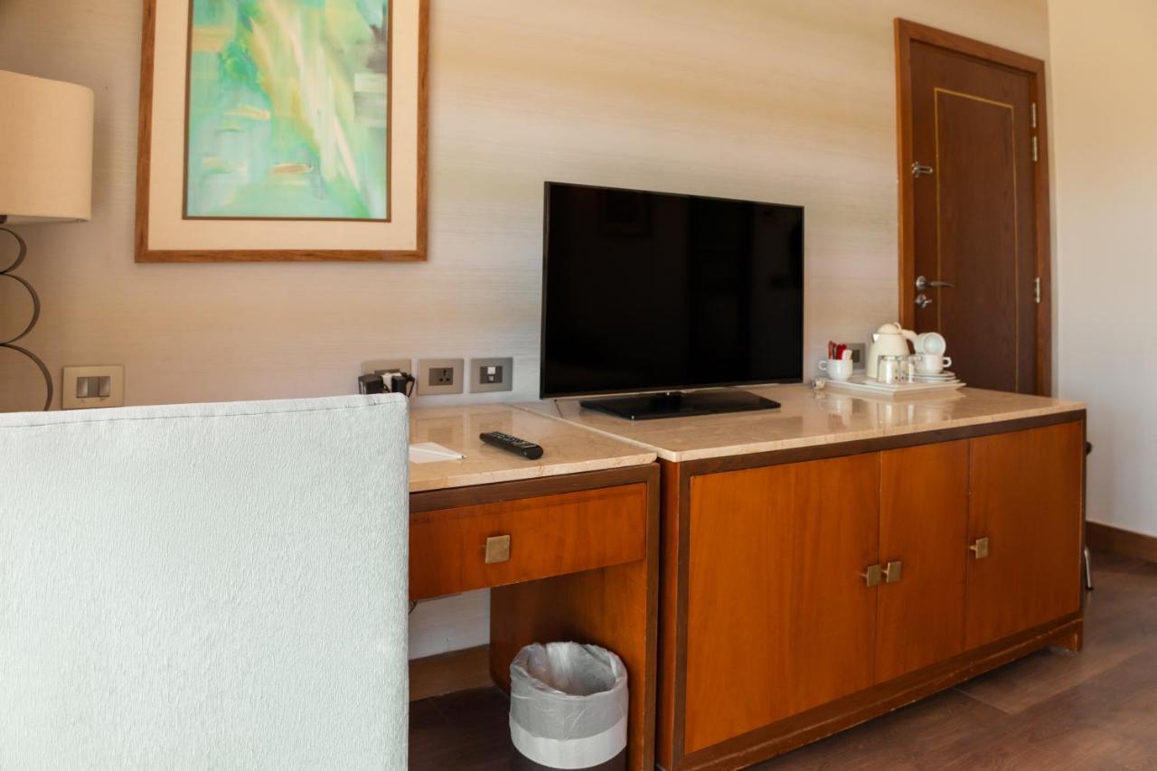 Sharm Dreams Vacation Club - Aqua Park Hotel Eksteriør billede A television in a hotel room